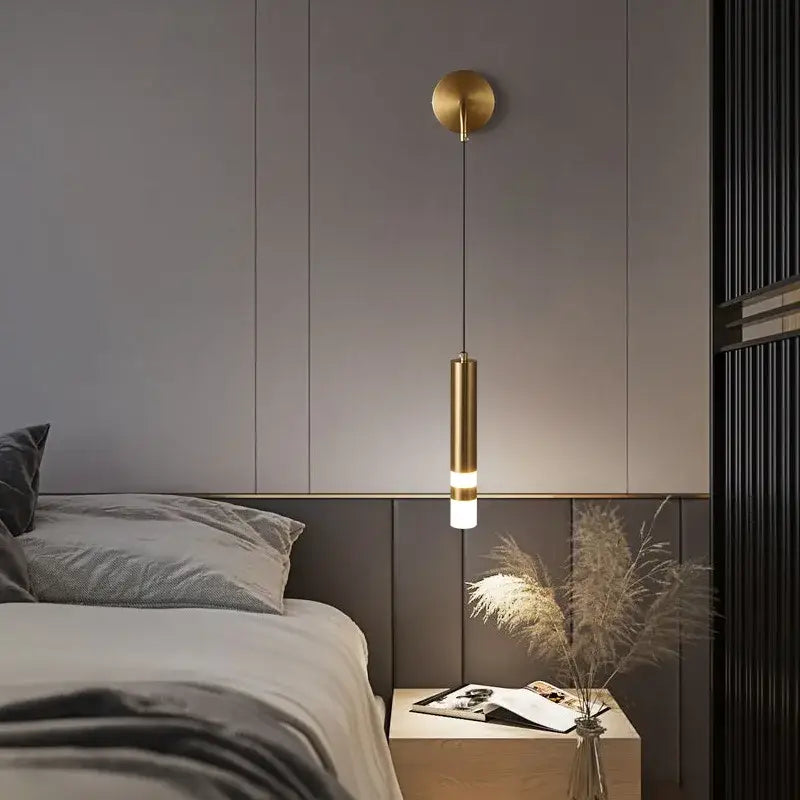 A sleek gold led wall lamp with frosted glass diffuser and black accents ideal for bedroom reading decorbites gold led