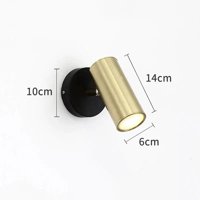 Modern black and gold led wall lamp with cylindrical gold-finished spotlight and black base for adjustable bedroom lighting
