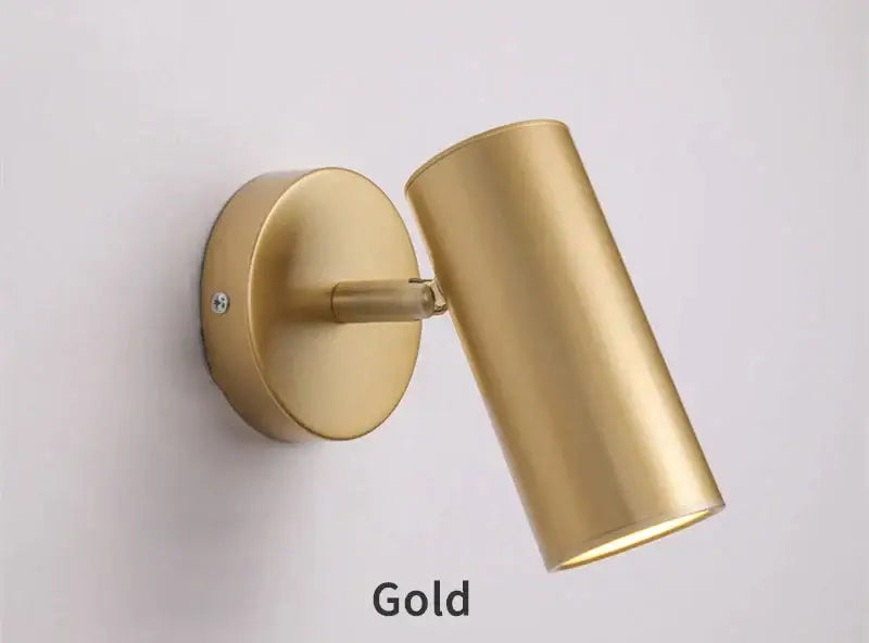 Gold-finished cylindrical led wall lamp with sleek modern design for adjustable bedroom lighting