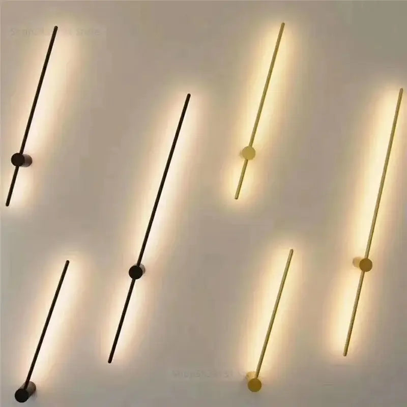 Modern black and gold led wall lamps with slender rods in matte black and brushed gold finish for minimalist decorbites wall lamps