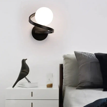 Modern black metal wall lights with sleek spiraling design and frosted globe for bedroom decorbites black copper led wall