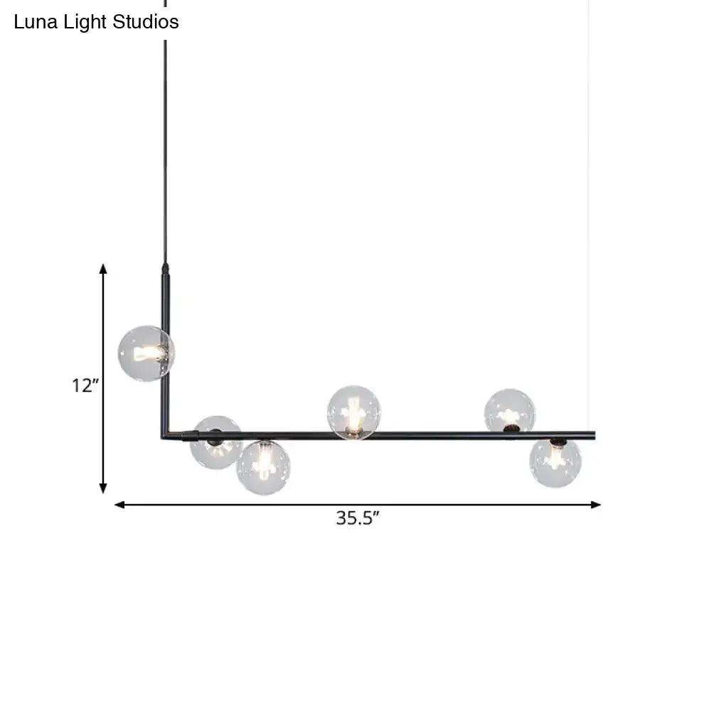 Modern black and gold linear chandelier with black metal l-shaped frame and six clear glass globe bulbs for dining room