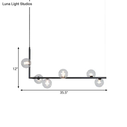 Modern black and gold linear chandelier with black metal l-shaped frame and six clear glass globe bulbs for dining room