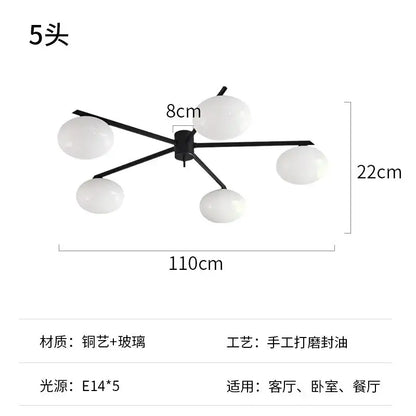 Modern black metal and gold lustre ceiling light fixture with five frosted glass globes for kitchen use