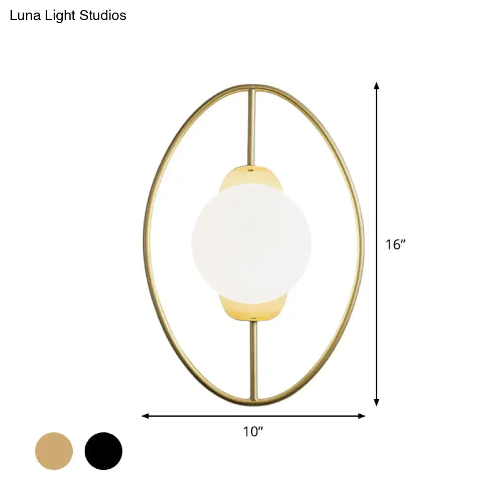 Modern black and gold metal halo ring wall lamp with white glass globe and minimalist oval metal frame for bedroom