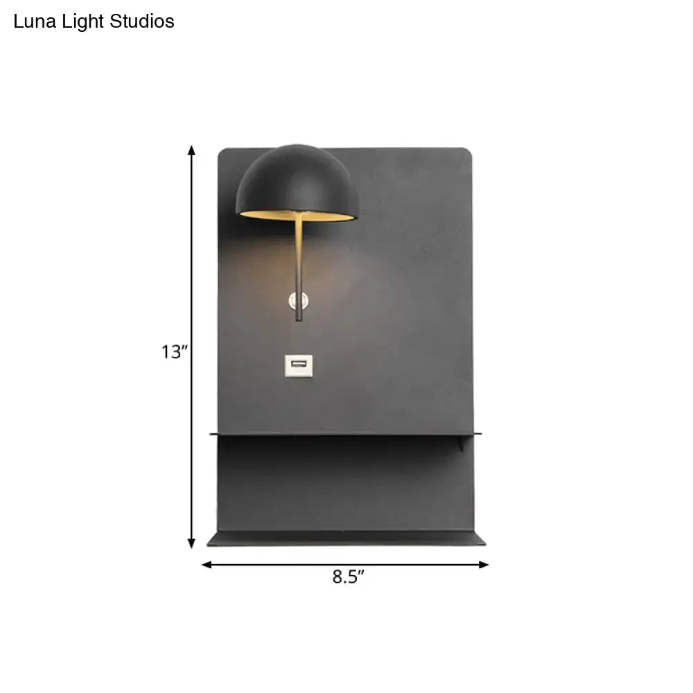 Modern metal wall sconce in black matte with gold stem and dome shade featuring integrated usb for living room use