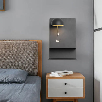 Modern metal wall light in black and gold with usb port designed for living room use with metal wall mounting