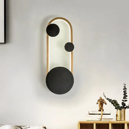 Modern wall lamp with gold metallic arched frame and three matte black accents for bedroom led light fixture