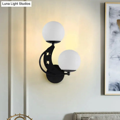 Modern black crescent wall lamp with milky glass ball frosted shades suitable for bedroom lighting