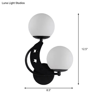 Modern black crescent moon wall lamp with milky glass ball shades and star cutouts for bedroom lighting