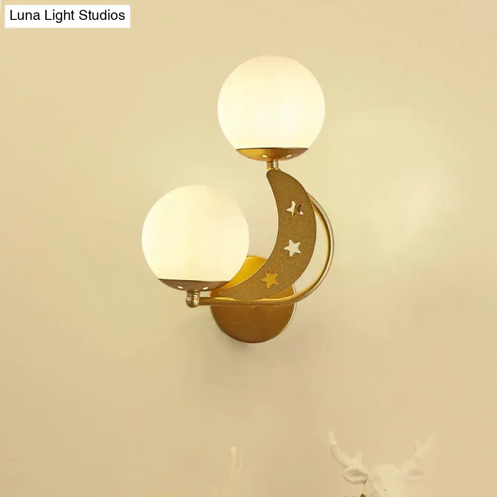 Modern black and gold crescent moon wall lamp with milky glass ball shades and star cutouts for bedroom lighting