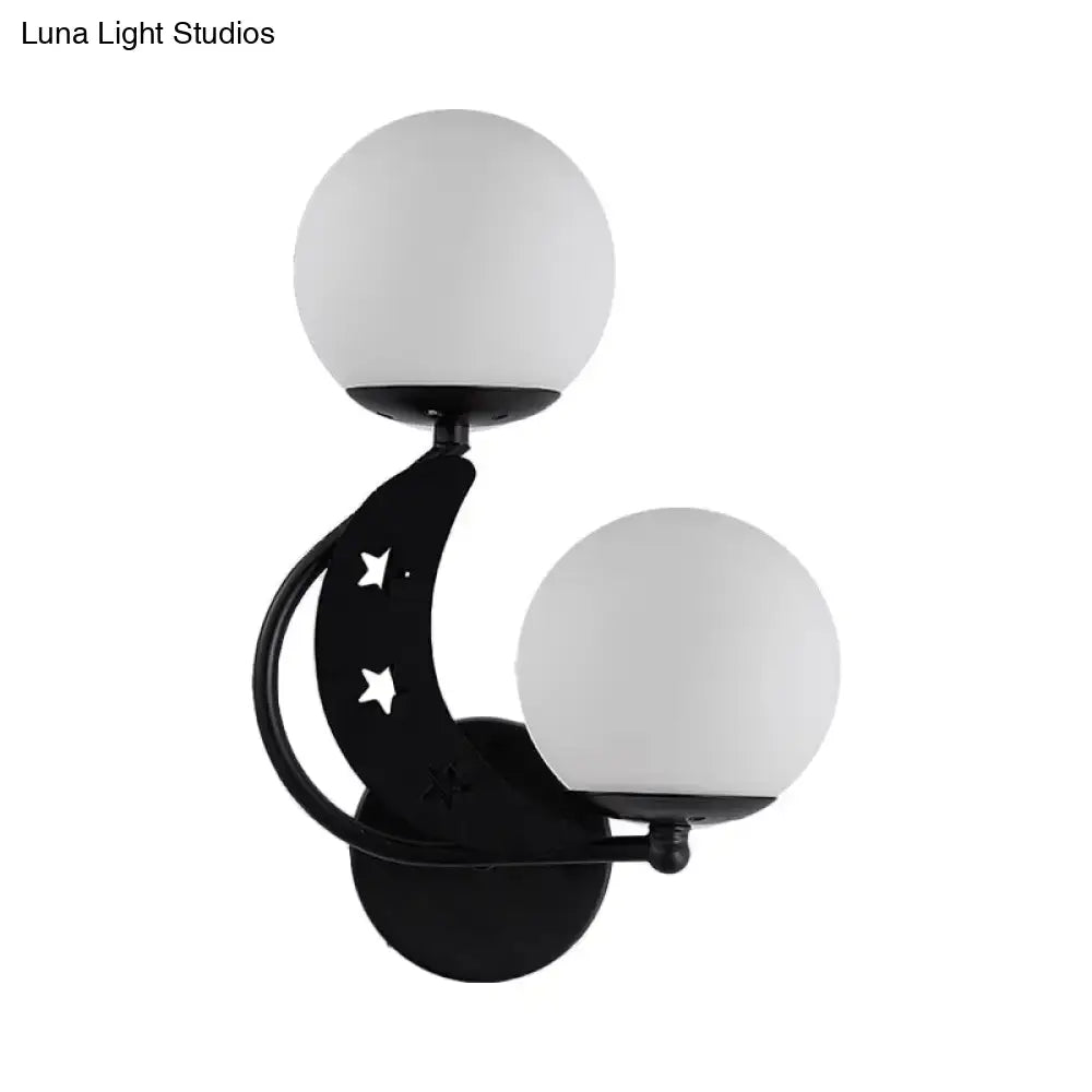 Modern black crescent moon wall lamp with milky glass ball shades and star cutouts for bedroom lighting