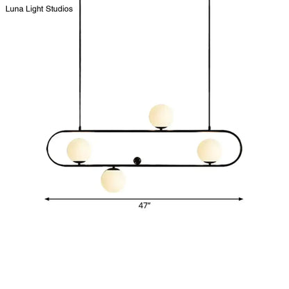 Modern black gold metal pendant light with four frosted opal glass globe bulbs for dining room LED lighting