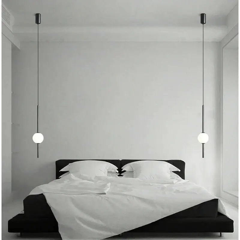 Modern black and gold pendant light with glass shade featuring minimalist spherical globes for living room decorbites gold pendant