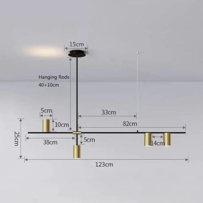 Modern black chandelier pendant light with sleek horizontal bar and gold cylindrical accents for kitchen island decorbites