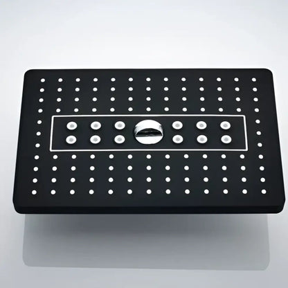 Modern black rainfall shower head with white circular nozzles and central chrome control knob for bathroom use