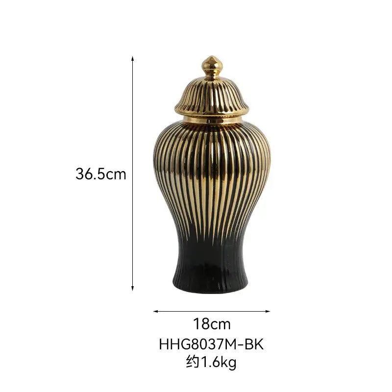 Elegant modern black and gold ceramic ribbed ginger jar vase with vertical detailing and matching golden lid for decor