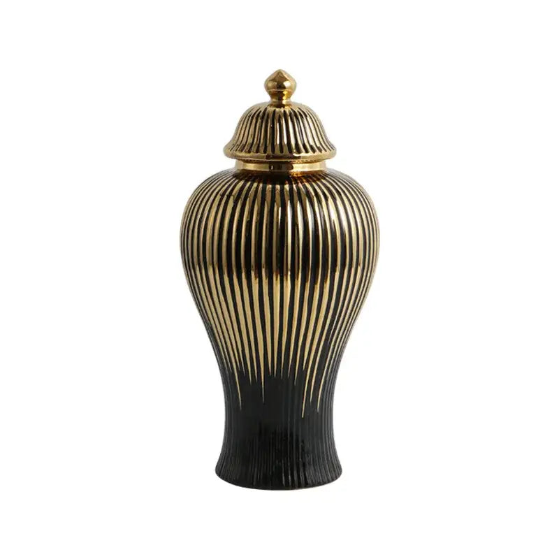 A sleek black and gold ceramic ginger jar vase with vertical ribbed detailing and a matching golden lid for living room decor