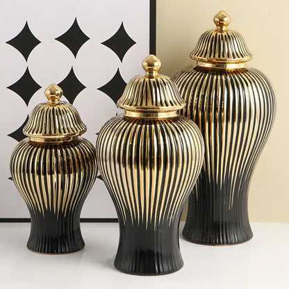 Set of three modern black and gold ribbed ceramic ginger jar vases with matching golden lids for living room decor