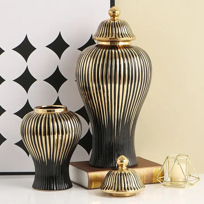 Elegant black and gold striped ceramic ginger jar vase with vertical ridges and polished metallic finish for living room decor