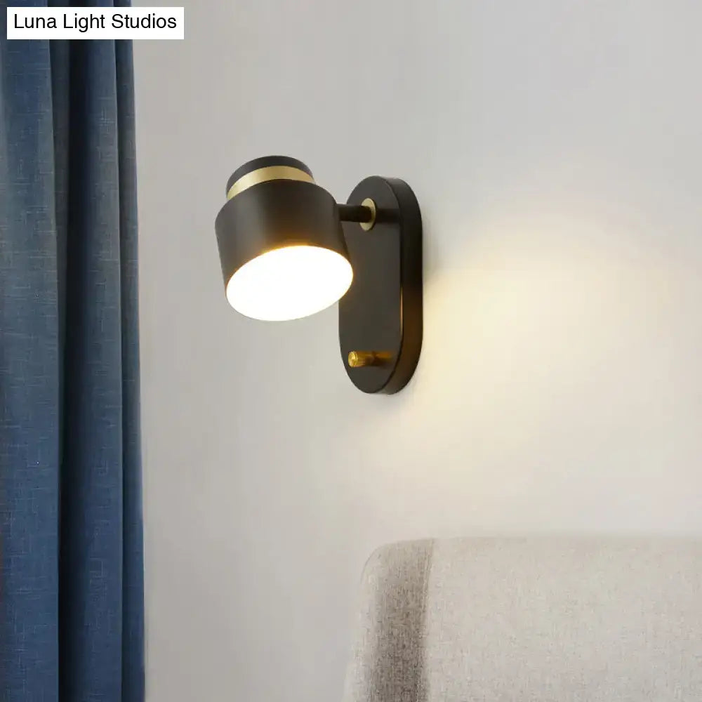Modern black and brass accent wall sconce with rotatable led light and sleek design for bedroom lighting