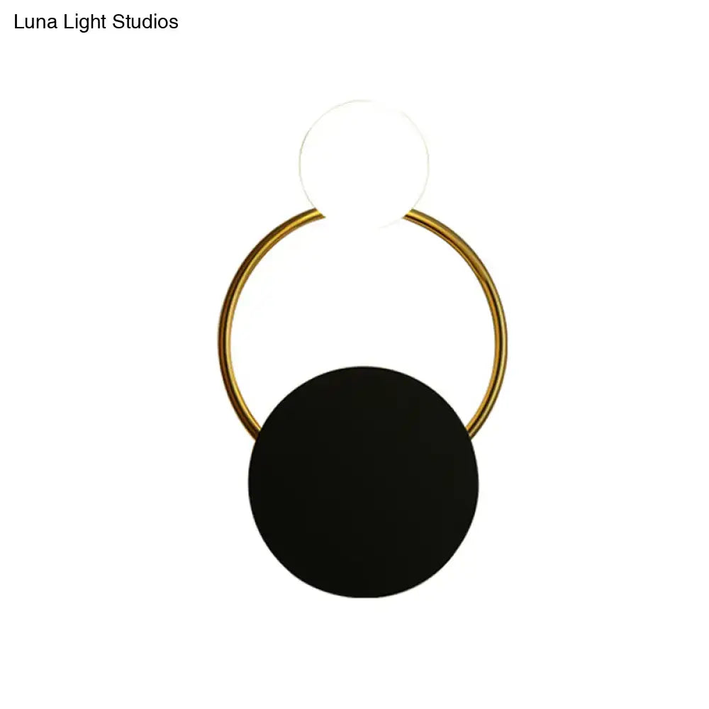 Minimalist gold round wall sconce with matte black disc accent direct wired electric for modern bedrooms