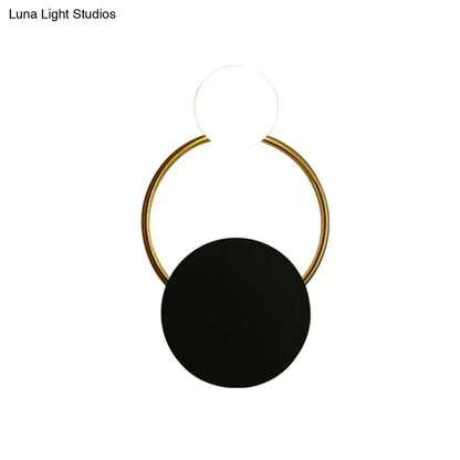 Minimalist gold round wall sconce with matte black disc accent direct wired electric for modern bedrooms