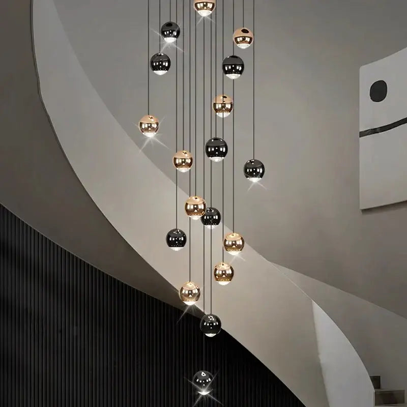 Modern black and gold spherical pendant light made of ironware alloy hanging above staircase for modern interiors
