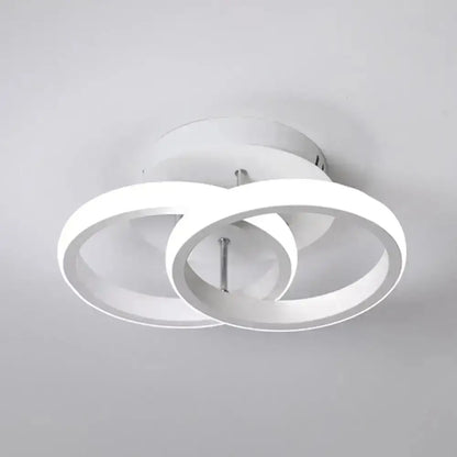 Modern white led ceiling lamp with two interlocking circular rings offering exceptional lighting efficiency for corridor use