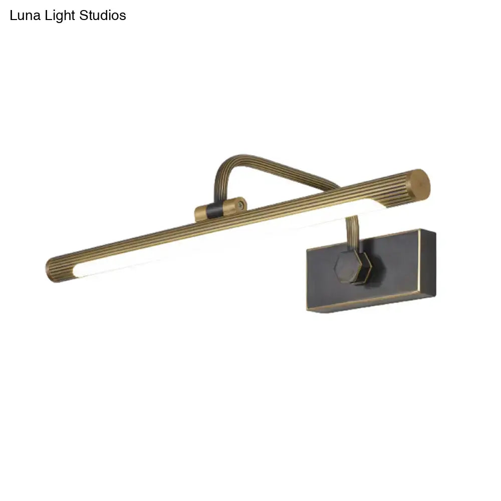 Brass-finished wall light with ribbed elongated bar and adjustable swing arm for modern bedroom vanity lighting