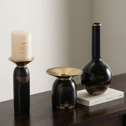 Modern black and gold tray vase candlestick set featuring a black ceramic vase with gold rim and abstract geometric patterns