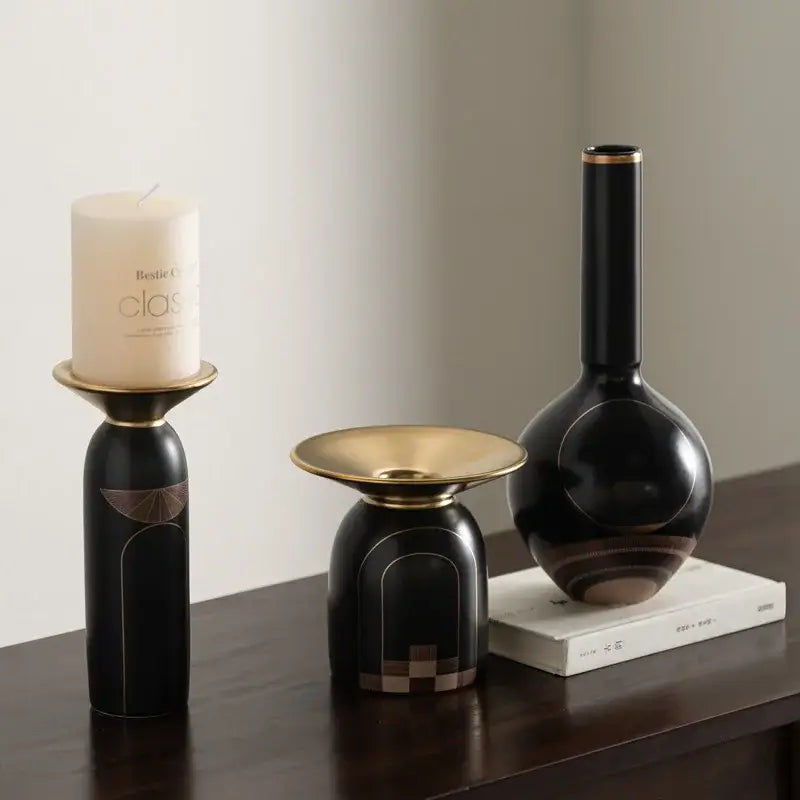 Modern black and gold tray vase candlestick set featuring a black ceramic vase with gold rim and abstract geometric patterns
