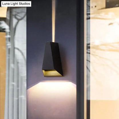 Modern black and gold geometric led wall light with warm white light and angular design for bedroom use