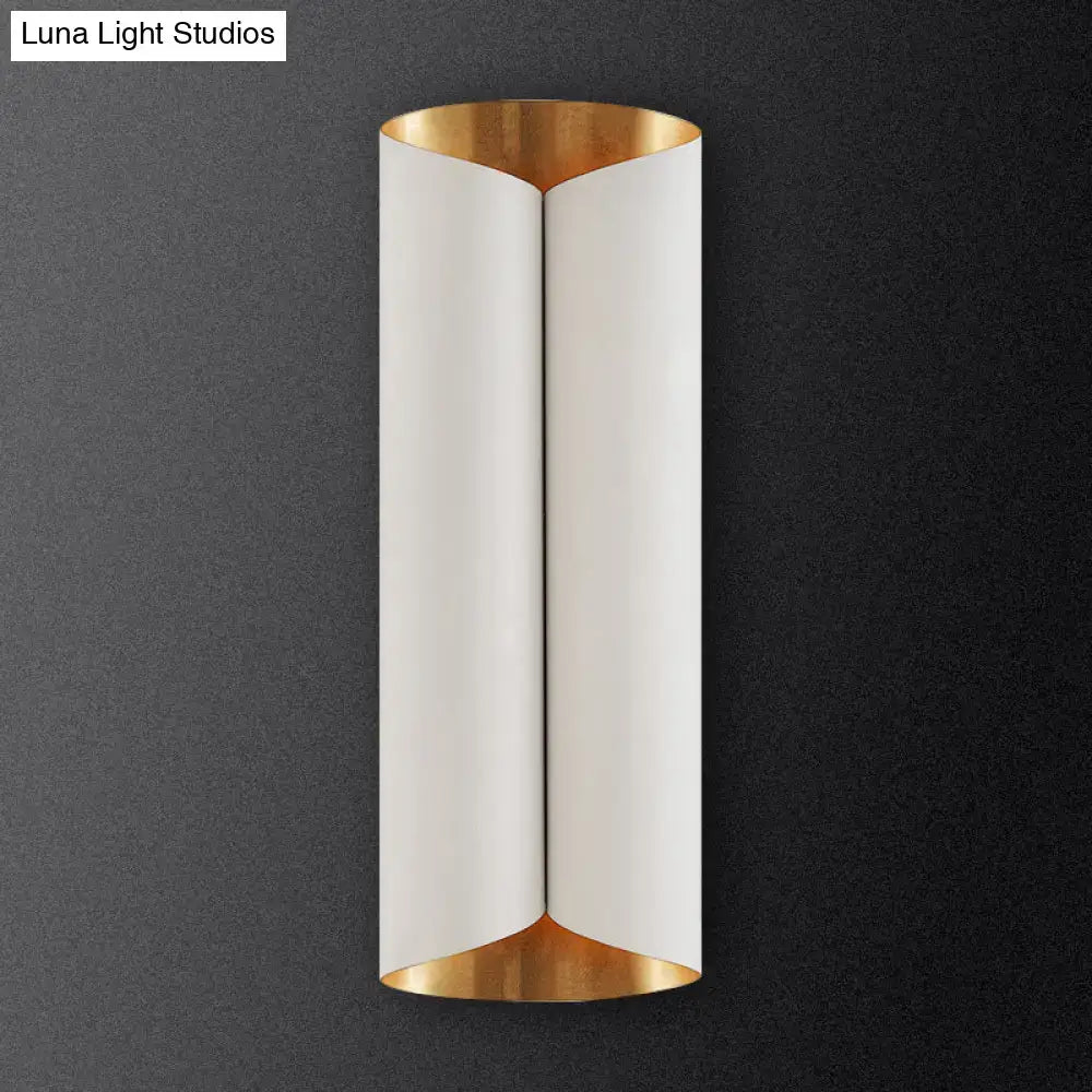 Modern black and gold twisted porch wall sconce with sleek curved white matte finish and polished gold bulb base light fixture