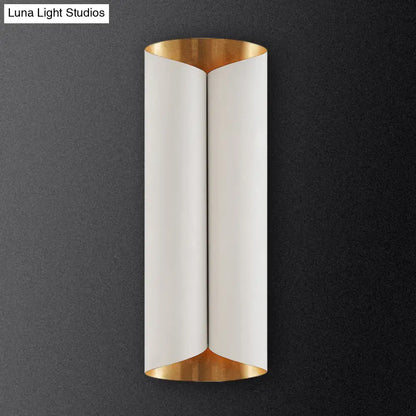 Modern black and gold twisted porch wall sconce with sleek curved white matte finish and polished gold bulb base light fixture