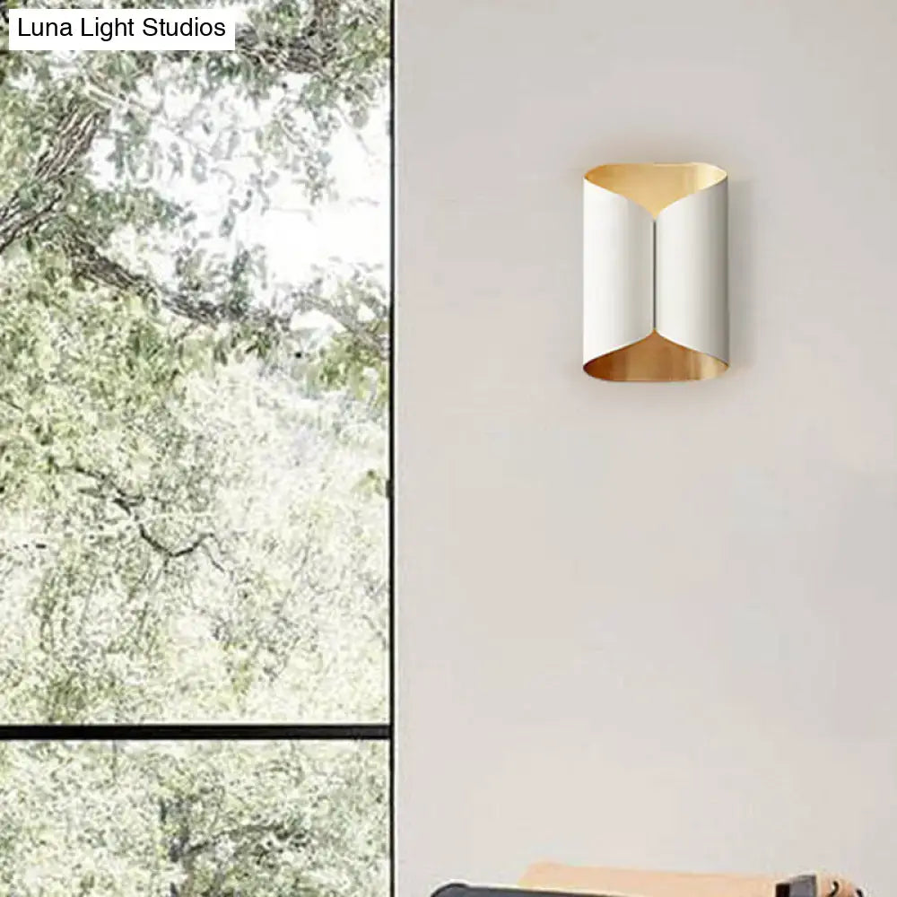 Modern black and gold twisted light fixture porch wall sconce with sleek curved design and bulb base metallic finishes
