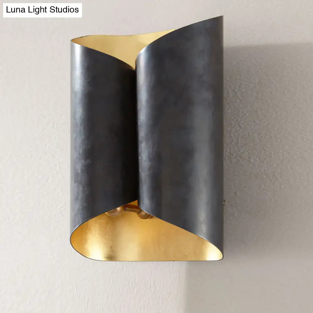 Modern black and gold twisted light fixture porch wall sconce with sleek folded metal design and bulb base detail