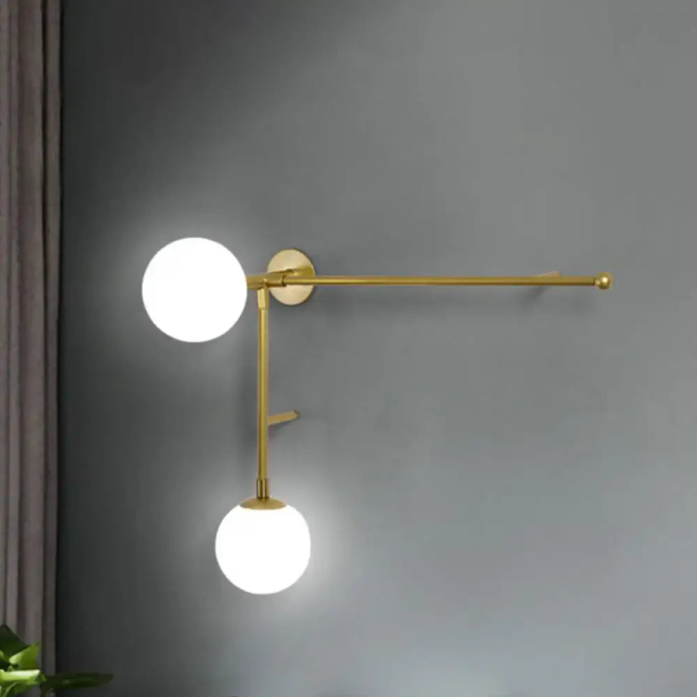 Modern gold-toned wall lamp with frosted glass shades and towel bar featuring direct wired electric modern design