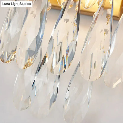 Modern black and gold wall lamp with clear crystal teardrop pendants for elegant bedroom sconce lighting