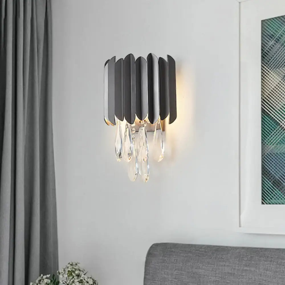 Modern black and gold wall lamp with clear crystal teardrops features a metal wall sconce ideal for bedroom lighting