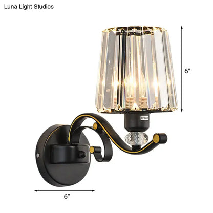 Modern black and gold wall lamp with clear glass faceted crystal shade ideal as a bedroom sconce