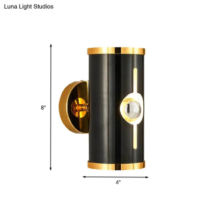 Modern black finish wall lamp with gold accents and vertical light strip for stylish bedroom sconce lighting