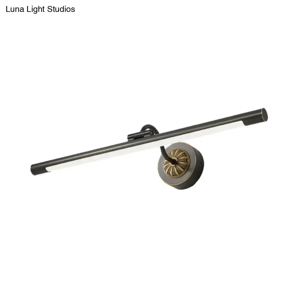 Modern black and brass wall light fixture with sleek design ideal for bedroom dressing table use