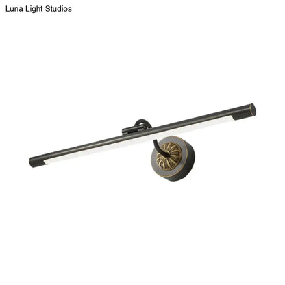 Modern black and brass wall light fixture with sleek design ideal for bedroom dressing table use