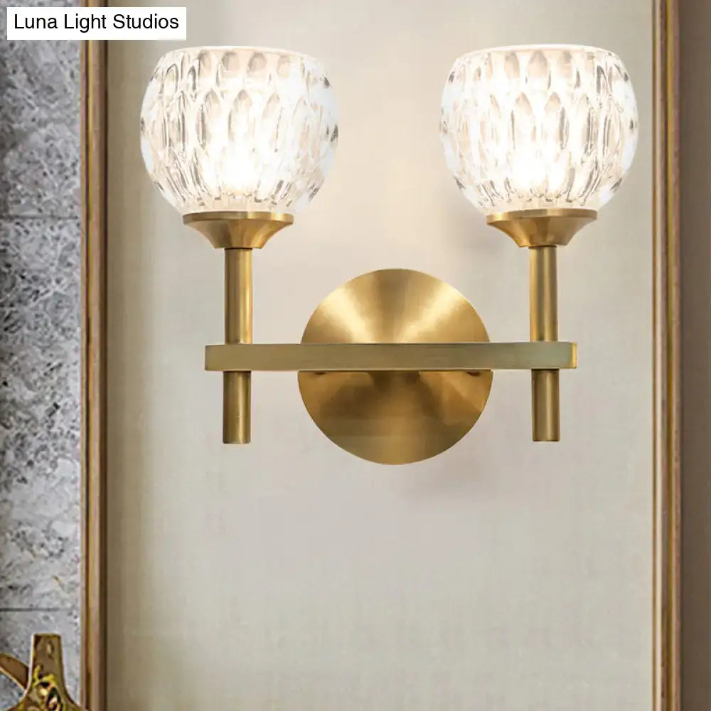 Brass-finished wall light with two dimpled glass shades for living room modern black and gold decor