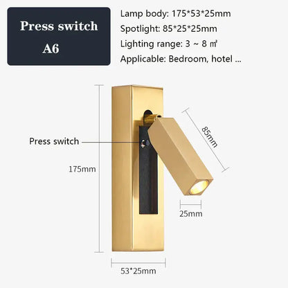 Modern black and gold wall sconce in black brass with gold-finished spotlight and integrated press switch for bedroom reading light