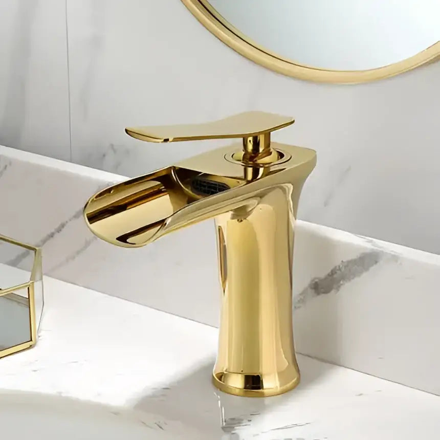Modern black and gold basin faucet with a gold waterfall bathroom spout by decorbites for sleek bathroom decor
