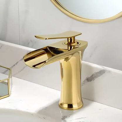 Modern black and gold basin faucet with a gold waterfall bathroom spout by decorbites for sleek bathroom decor