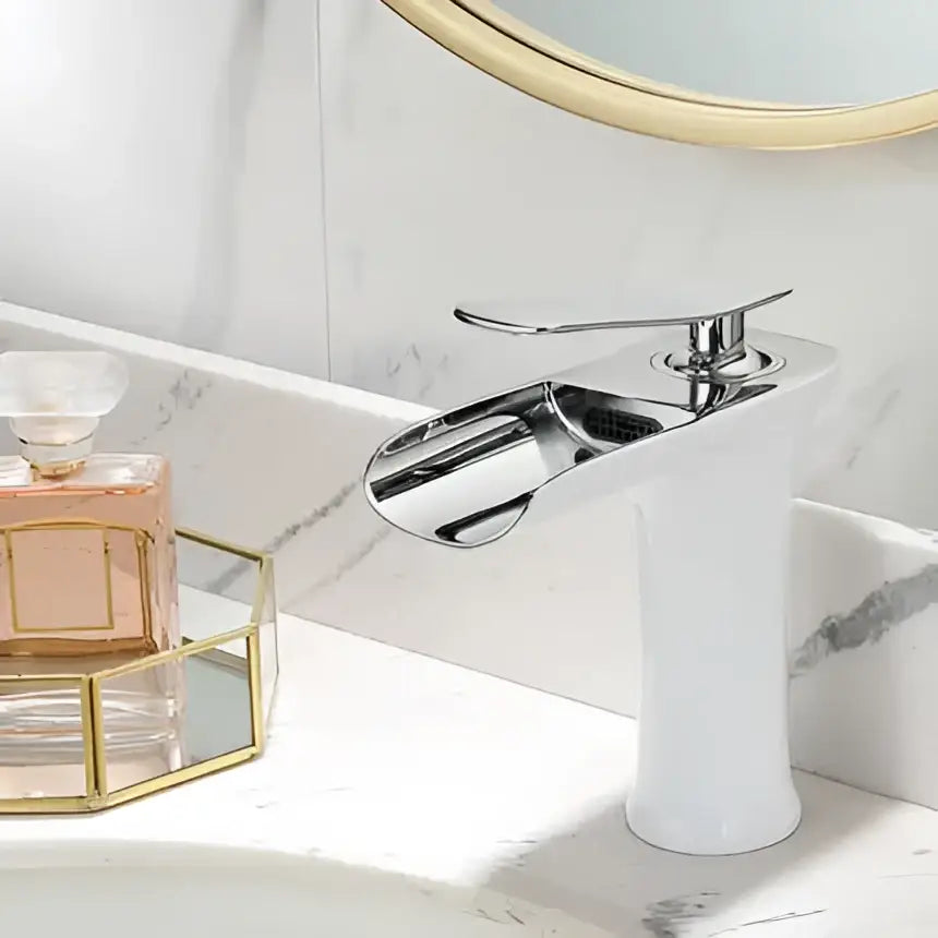 Chrome-finished basin faucet with sleek modern design and cylindrical base for decorbites gold waterfall bathroom use