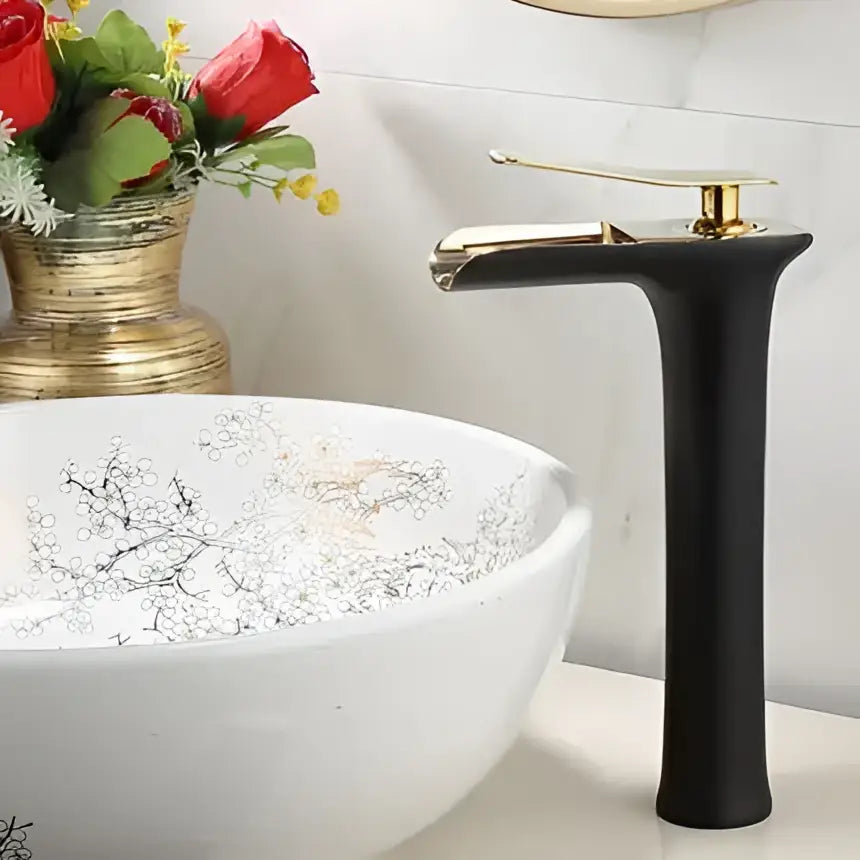 Modern black and gold waterfall basin faucet with matte finish and decorbites gold waterfall bathroom accents
